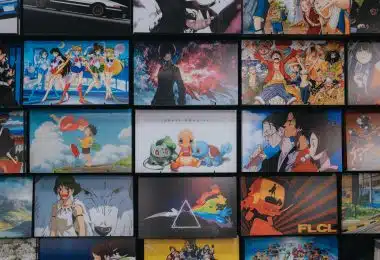 anime character collage photo on black wooden shelf